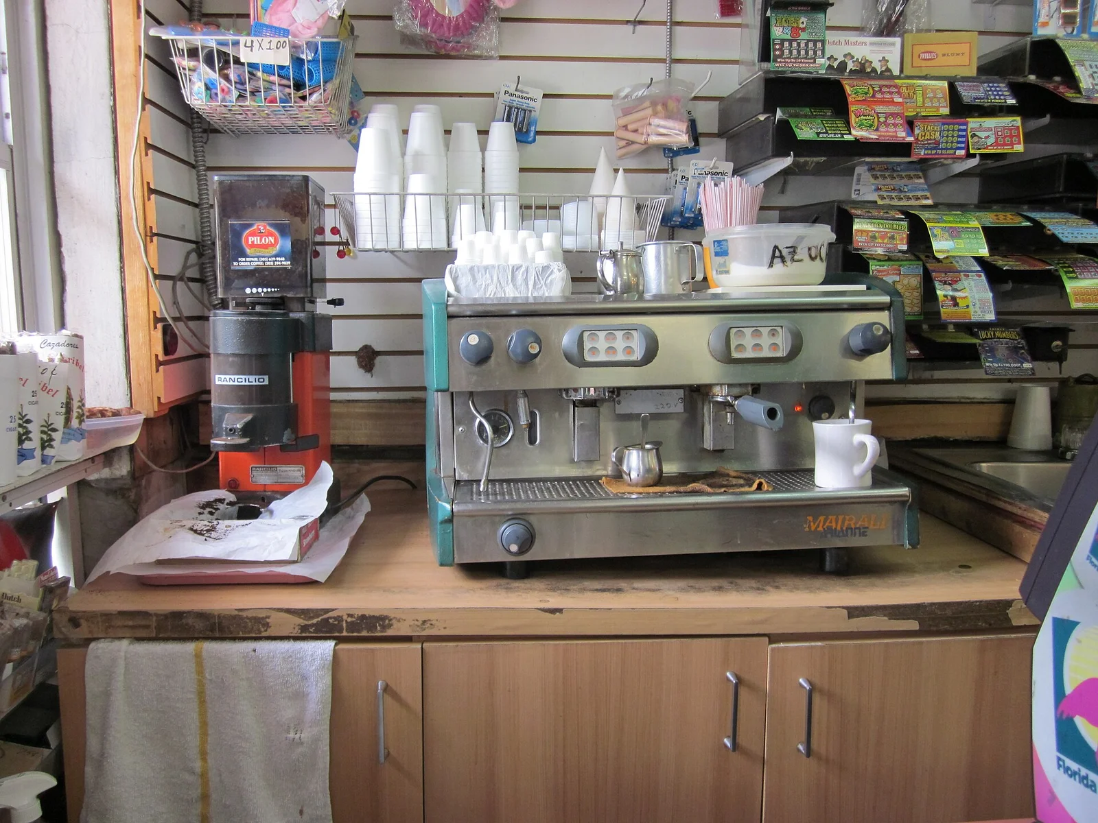 An espresso machine and grinder at a Cuban coffee counter on Calle Ocho in Little Havana.