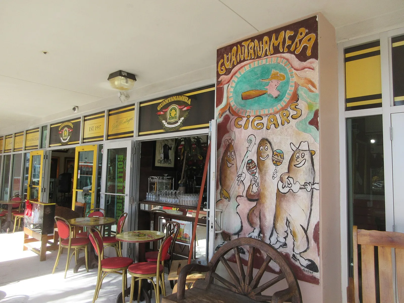Cafe tables outside a cigar shop on Calle Ocho in Little Havana