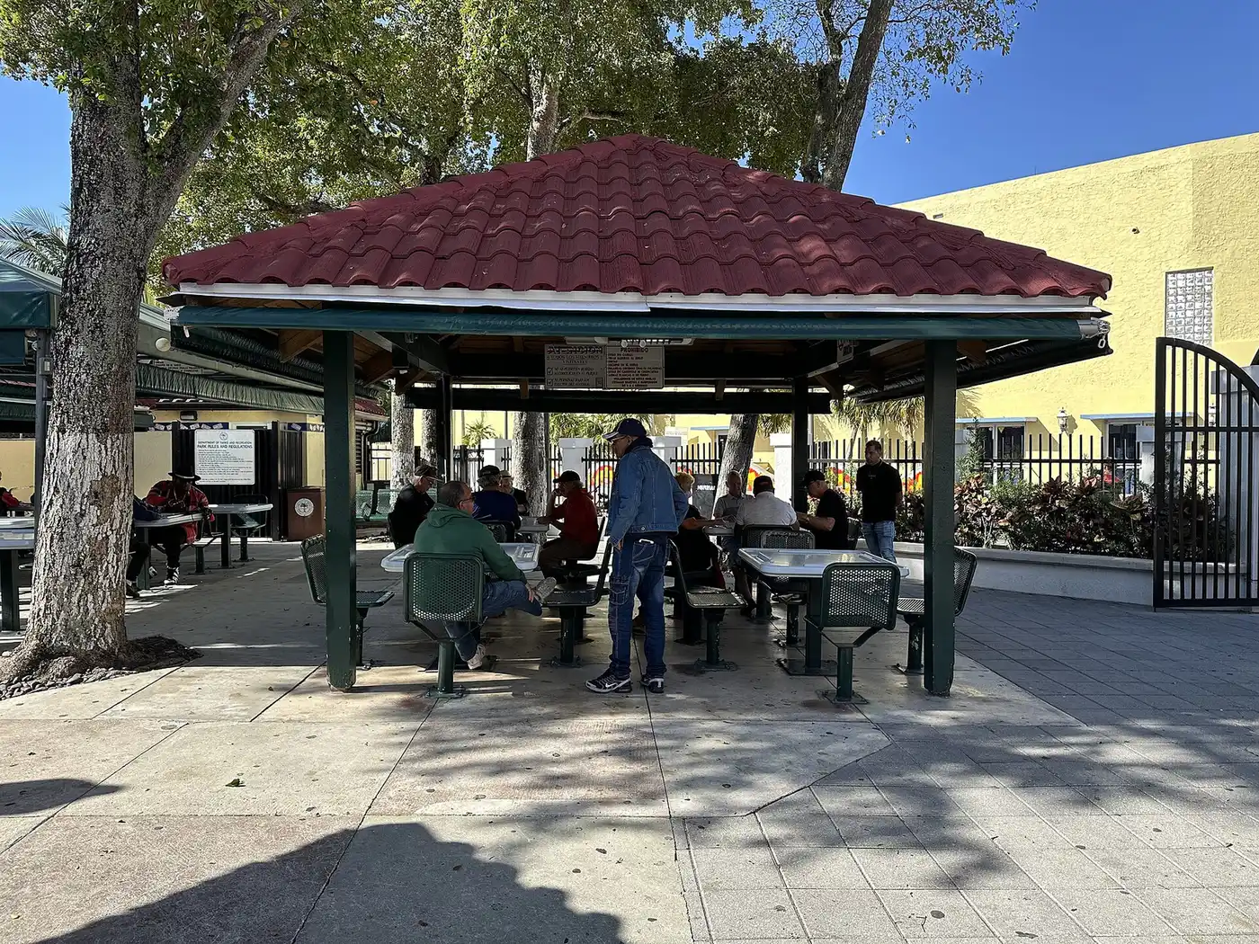 Domino players under the pavilion at Domino Park on Calle Ocho in Little Havana.