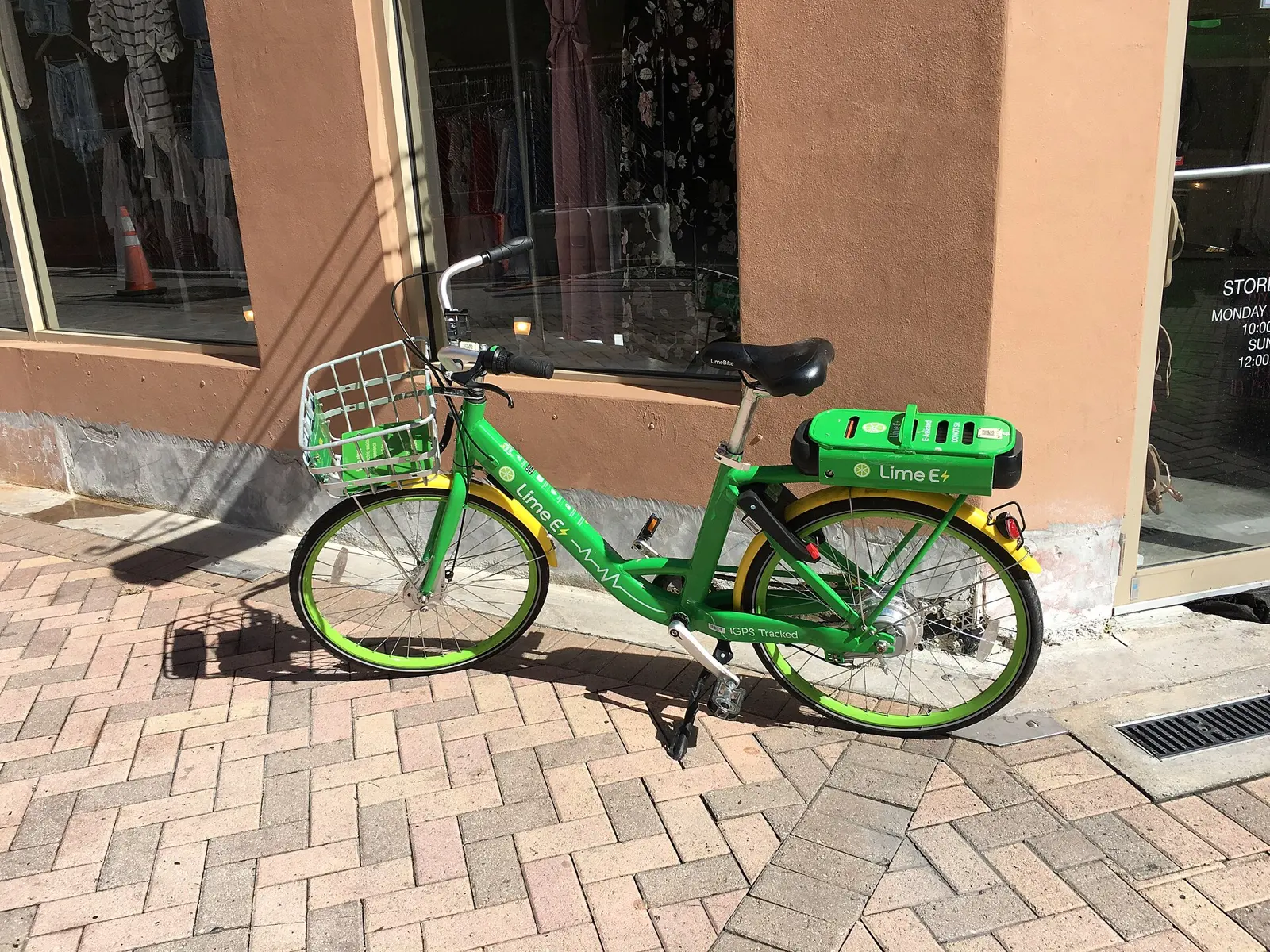 A rental electric bike parked on a brick sidewalk in Brickell.